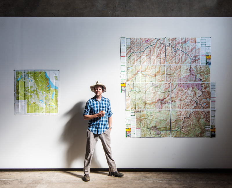 Mike Mullen with maps of Desolation Wilderness and Yosemite